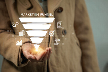 A person in a brown coat holds a digital marketing funnel with financial and business-related icons.
