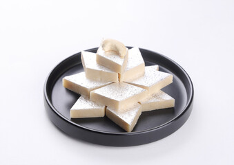Indian Sweet called Kajukatli or Kajuukatli serve in plate isolated on white background 