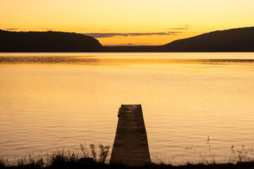 New Zealand landscape of a lake and jetty at sunrise