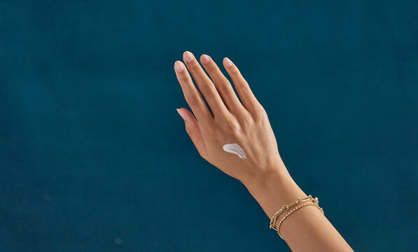 lotion, swipe, hand, blue background