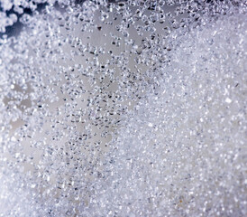 Close up of crystal sugar in Glass bottles on white background.