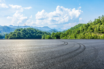 Asphalt road and green mountain with sky clouds nature landscape in summer