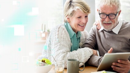 Senior couple using a tablet remix