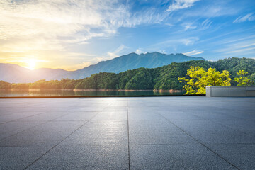Empty square floor and beautiful lake with mountain natural landscape at sunset