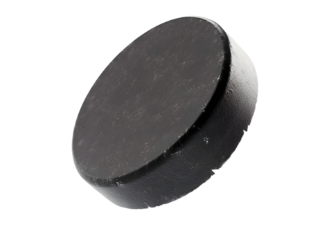 A close-up of a hockey puck, emphasizing its sleek black surface and circular shape, ideal for sports-related themes.