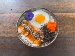 Japanese food. Salmon rice bowl. Burn salmon dressing with teriyaki sauce 