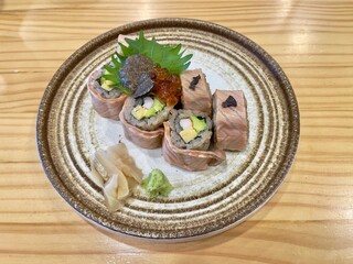 Japanese food, salmon rolls with truffle and vegetables