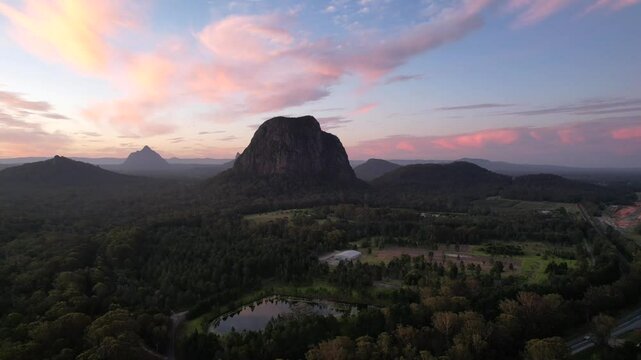 Aerial shot of mountains at sunset - Glass House Mountains