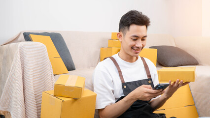 SME and packaging delivery concept. Portrait of Starting small businesses. Entrepreneurs check online orders to prepare to pack and sell to customers. use cellphone typing to courier