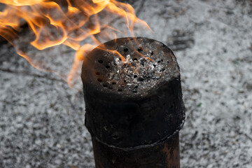 Flare stack. Natural gas burns in pipe.