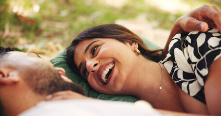 Outdoor, relax and couple on date, picnic and smile for conversation in nature, embrace and relationship. Happy, man and bonding with woman on anniversary, people and together for romance or love