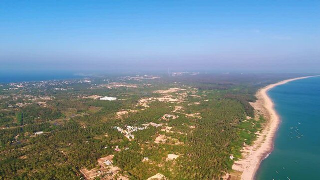 aerial view of a tamil nadu coastal village, surrounded by lush greenery