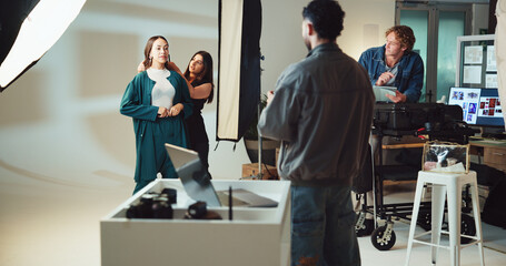 Obraz premium Photography, studio and photographer with model on set for creative, about us or career. Media, production and female person with behind the scenes photoshoot for fashion magazine cover with agency