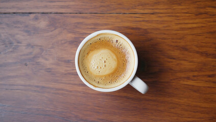 capucino coffee top view on tobe of dark wooden table