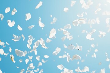 Floral Ascent: Captured from a low angle, delicate white flower petals ascend against a vivid blue sky, creating a sense of lightness and celebration.