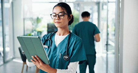 Nurse, woman and research with tablet in hospital for online medical records, healthcare report or treatment plan. Medicine, doctor or reading on digital app for clinic schedule or health information