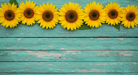 Obraz premium Bright Yellow Sunflowers on Weathered Blue Wooden Planks