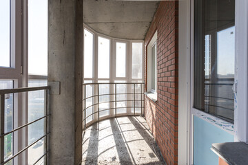 the balcony of an apartment on the upper floors of an apartment building