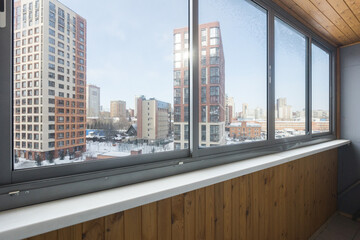 Fototapeta premium the balcony of an apartment on the upper floors of an apartment building