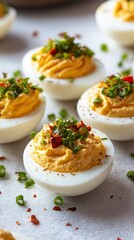 Delicious deviled eggs with bacon and chives for a savory and indulgent culinary experience on a plate