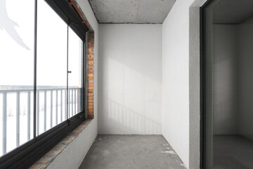 the balcony of an apartment on the upper floors of an apartment building