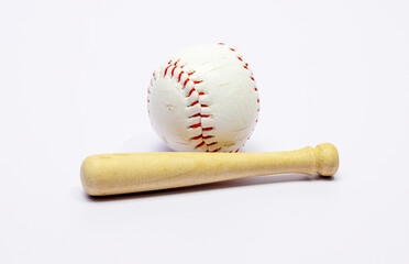 Toy baseball bat and ball on white background