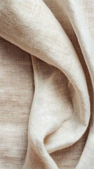 A close-up of soft, textured fabric in a natural, neutral tone.
