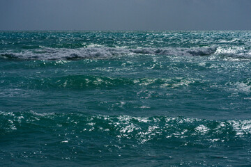 Tranquil wave motion. Summer seaside breeze. Sea nature backdrop. Peaceful holiday destination. Dreamy ocean horizon. Coastal paradise wallpaper. Seafoam waves. Scenic tropical travel.