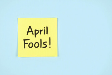 yellow sticky note with the words April Fools written on it