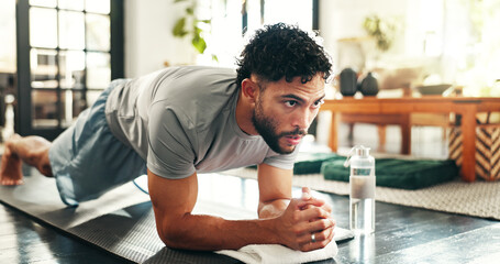Fitness, man and plank in home for workout, training or thinking of balance. Core exercise, muscle...