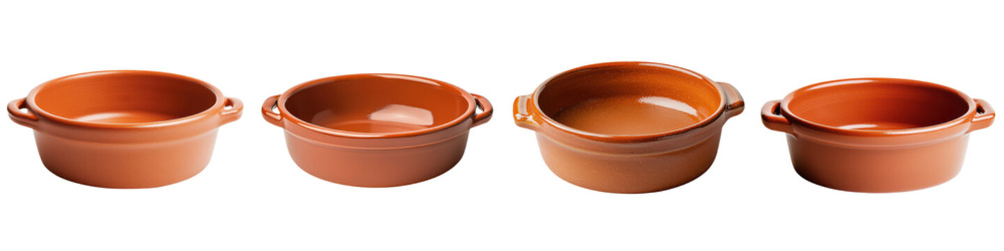 A set of rustic handmade terracotta bowls in shades of brown and orange perfect for preparing and serving home cooked meals and traditional cuisine