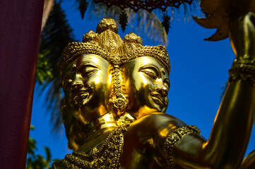 Fototapeta premium Statues Brahma, Symbols of Buddhism, South East Asia at San Pu Loei Saleewiangkaew Temple, Chiang Mai, Northern Thailand