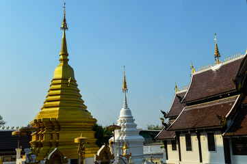 Fototapeta premium Pagoda and Chapel, Lanna Architecture, Symbols of Buddhism, South East Asia at San Pu Loei Saleewiangkaew Temple, Chiang Mai, Northern Thailand