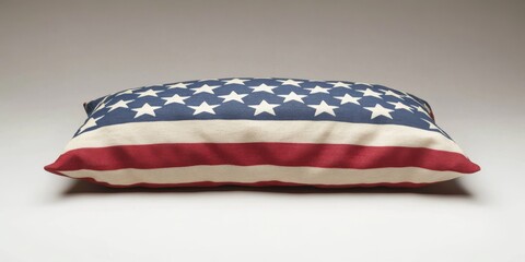 Obraz premium American flag printed on a rectangular pillow resting on a white surface