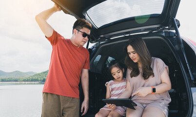 Summer vacations.Happy family enjoying trip with their favorite car. Holiday and travel family concept.