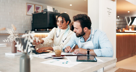 Business woman, laptop and discussion in cafe for review, social media and retail management. Owner, team meeting and coffee shop investor for sales graph, restaurant profit or hospitality startup