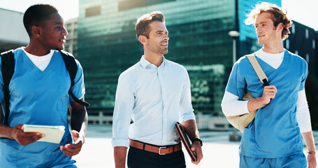 Professor, medical and men students walking for studying, nursing program and healthcare opportunity. People, teacher and travel for morning commute, learning internship and university course in city
