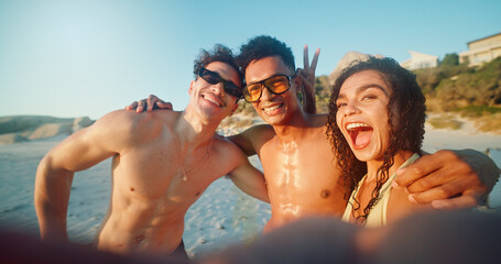 Obraz premium Beach, selfie and portrait of friends by ocean on vacation, adventure or holiday together for travel. Fun, happy and people by sea with photography picture on tropical weekend trip for memory.