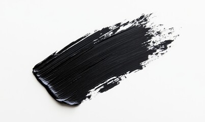 Black paint stroke on white background.