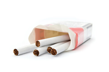 Cigarette tobacco in opened package isolated on white