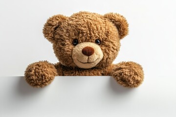 Obraz premium Happy teddy bear holding blank sign, studio shot