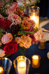 Floral centerpiece with candlelight for a romantic wedding setting