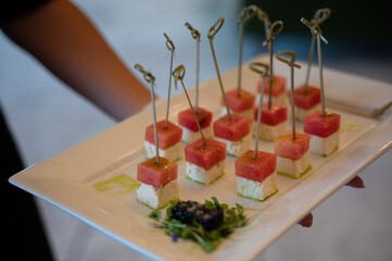 Elegant watermelon and feta skewers served at a wedding reception