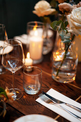 Elegant Table Setting with Candles and Flowers