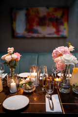Elegant Dining Table with Flowers and Candles