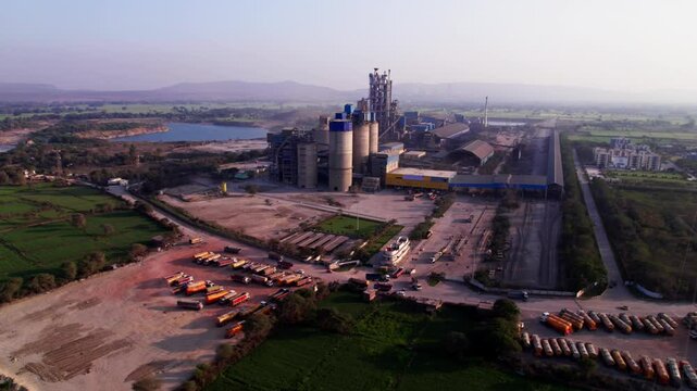 KJS Cement Limited Factory with KJS colony township and lake at Katiya Kalan, Girgita, Madhya Pradesh, india. day time, sami orbit, drone shot, 4k.