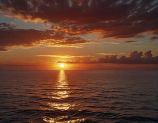 Fototapeta premium Seascape with scarlet sunset with sun on the horizon