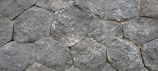 Stone wall texture. Old castle wall texture background. Stone wall as background or texture. Part of a stone wall, for background or texture	
