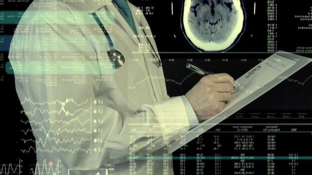 The doctor looks at the scans and fills out the paperwork