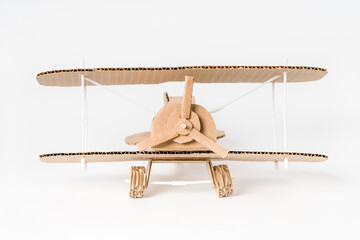 Handmade cardboard biplane front view, DIY vintage airplane model © Iana Alter